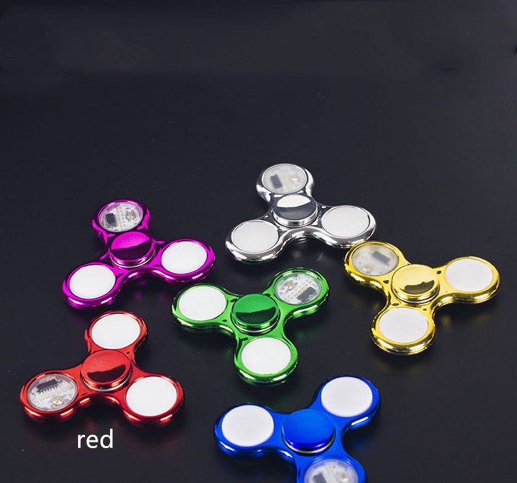 Fidget Spinner à lumière LED qui brille dans le noir